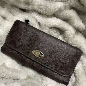 Coach slim trifold wallet.
